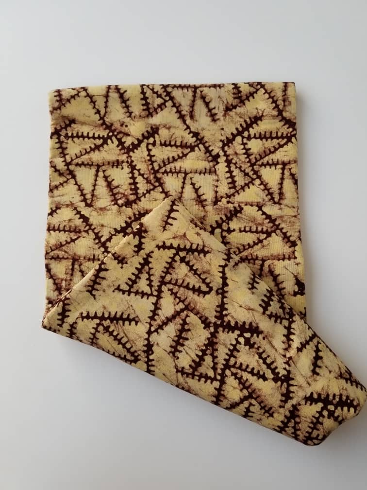 Cream and Brown Triangle Zip like printed Batik Fabric