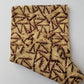 Cream and Brown Triangle Zip like printed Batik Fabric